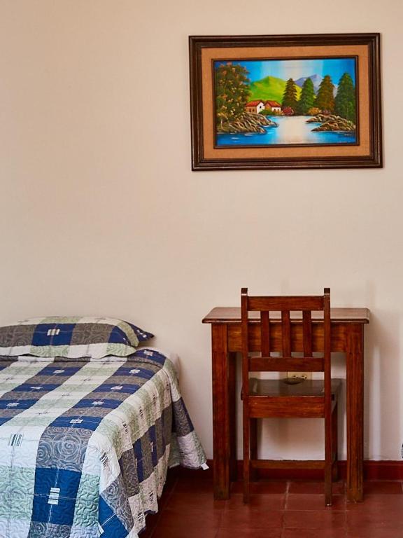 Postel nebo postele na pokoji v ubytování La Posada Copan
