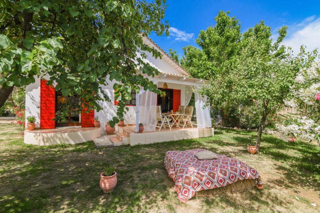 a bed in the yard of a house at Therianos Traditional Villas in Kallithea