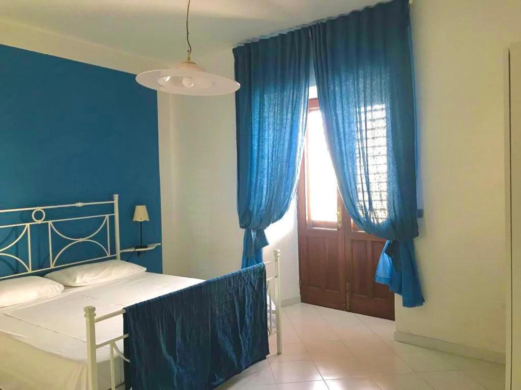A bed or beds in a room at (Porto Santa Marina) Casa Nanny