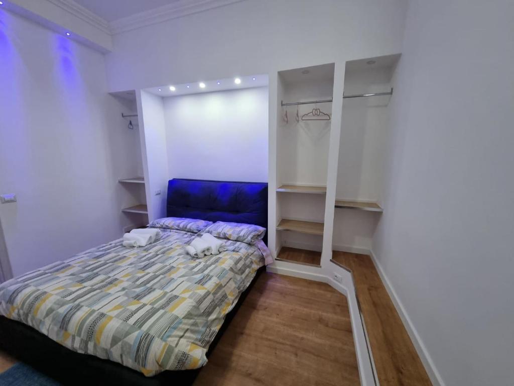 Posteľ alebo postele v izbe v ubytovaní Piazza Colombo-Apartments