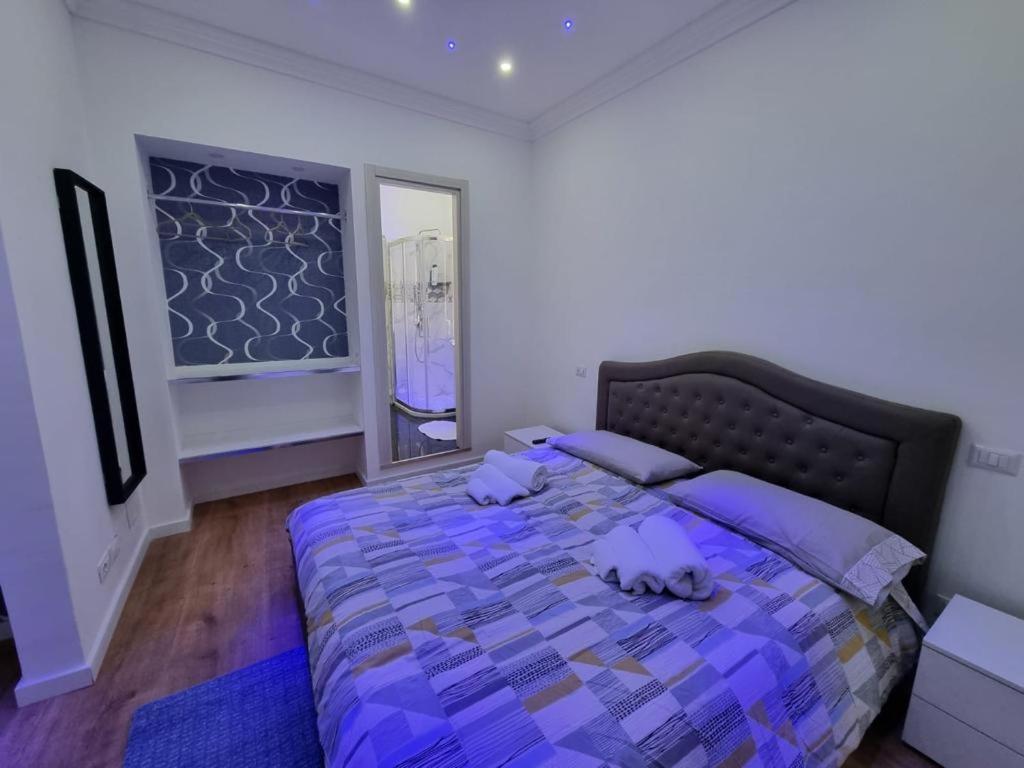 Posteľ alebo postele v izbe v ubytovaní Piazza Colombo-Apartments