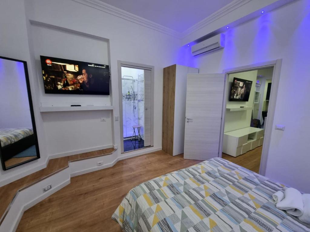Televízia a/alebo spoločenská miestnosť v ubytovaní Piazza Colombo-Apartments