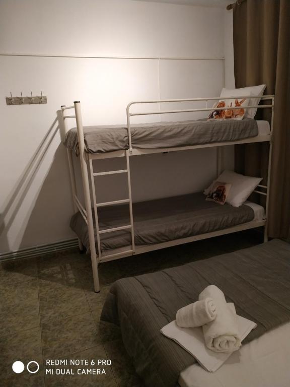 A bed or beds in a room at Alexander Apartments Nea Koutali