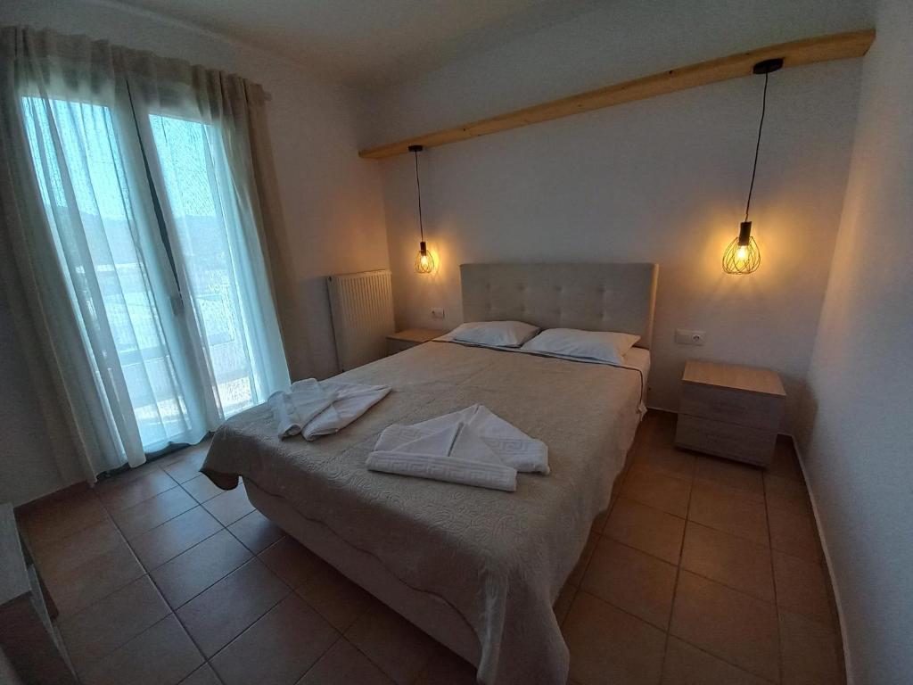 Posteľ alebo postele v izbe v ubytovaní Achilli Apartments