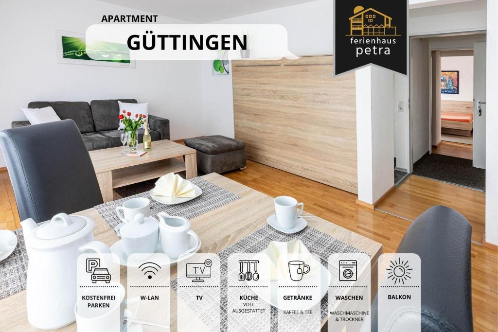 una sala de estar con una mesa con jarrones blancos. en Große moderne Ferienwohnung in bester Bodenseelage l 1 Minute zum Bodensee l 2 Zimmer l Vollausgestattete Küche l Sonnenbalkon l WLAN l Willkommen im Apartment Güttingen, en Radolfzell am Bodensee