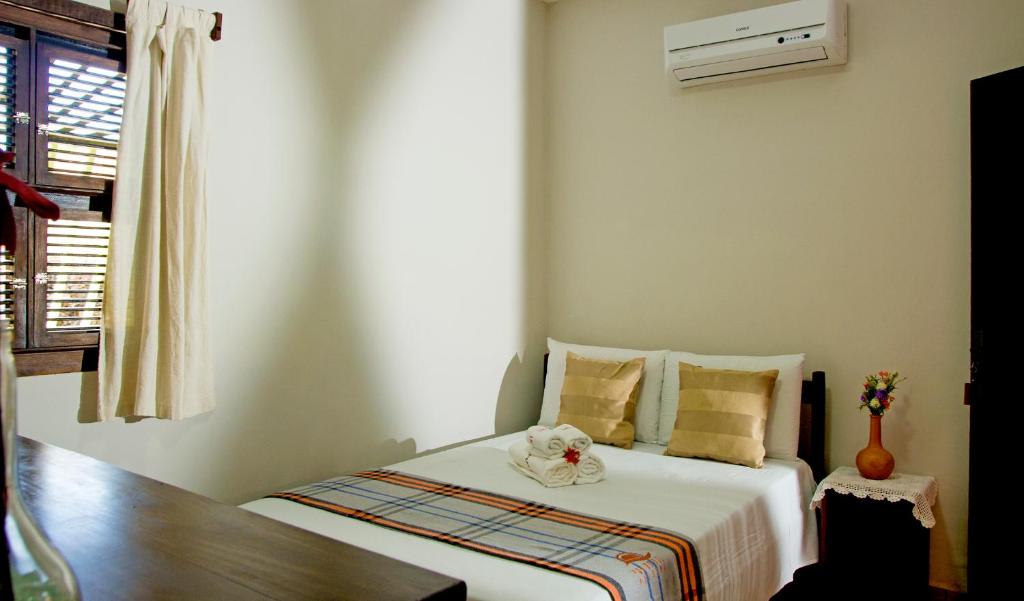 Cama ou camas em um quarto em Pousada Por do Sol