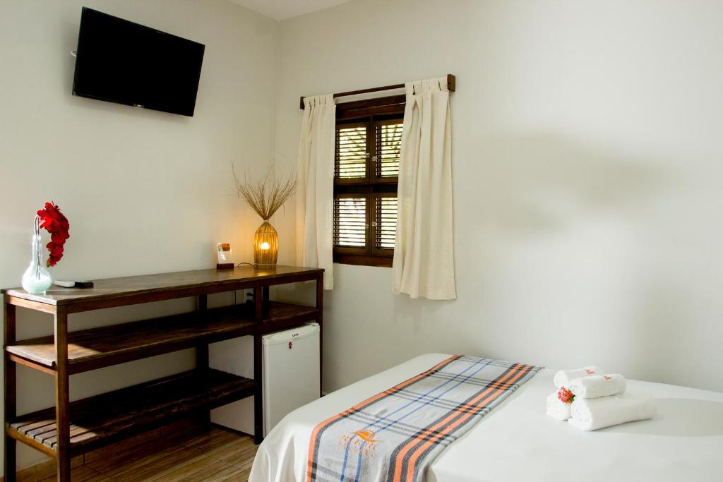Cama ou camas em um quarto em Pousada Por do Sol