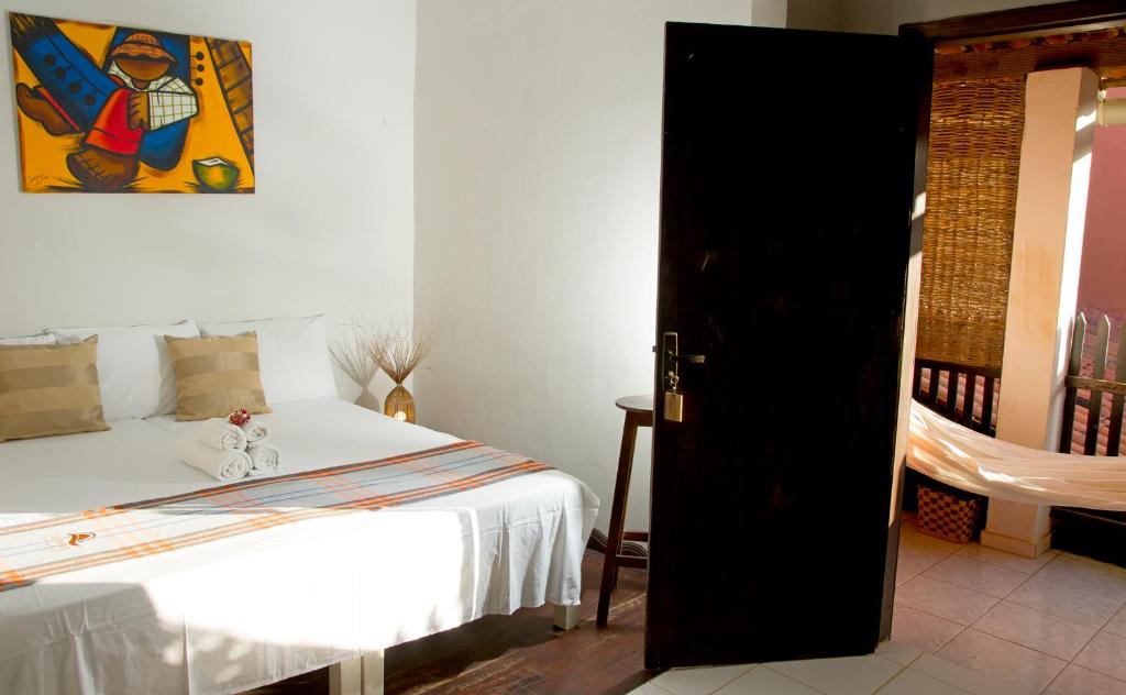 Cama ou camas em um quarto em Pousada Por do Sol