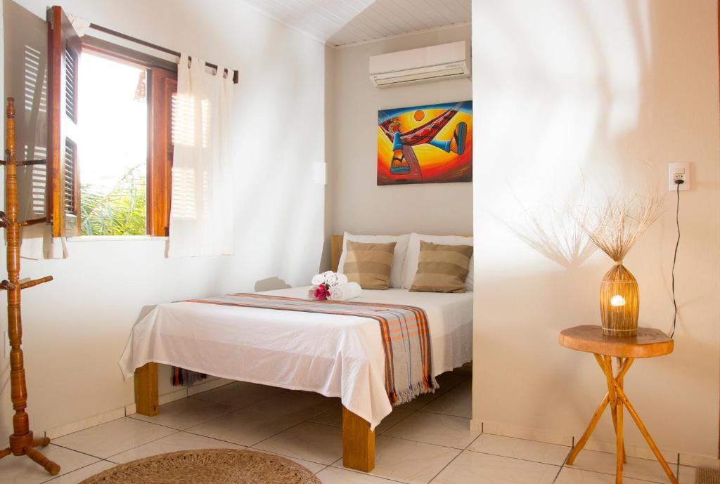 Cama ou camas em um quarto em Pousada Por do Sol
