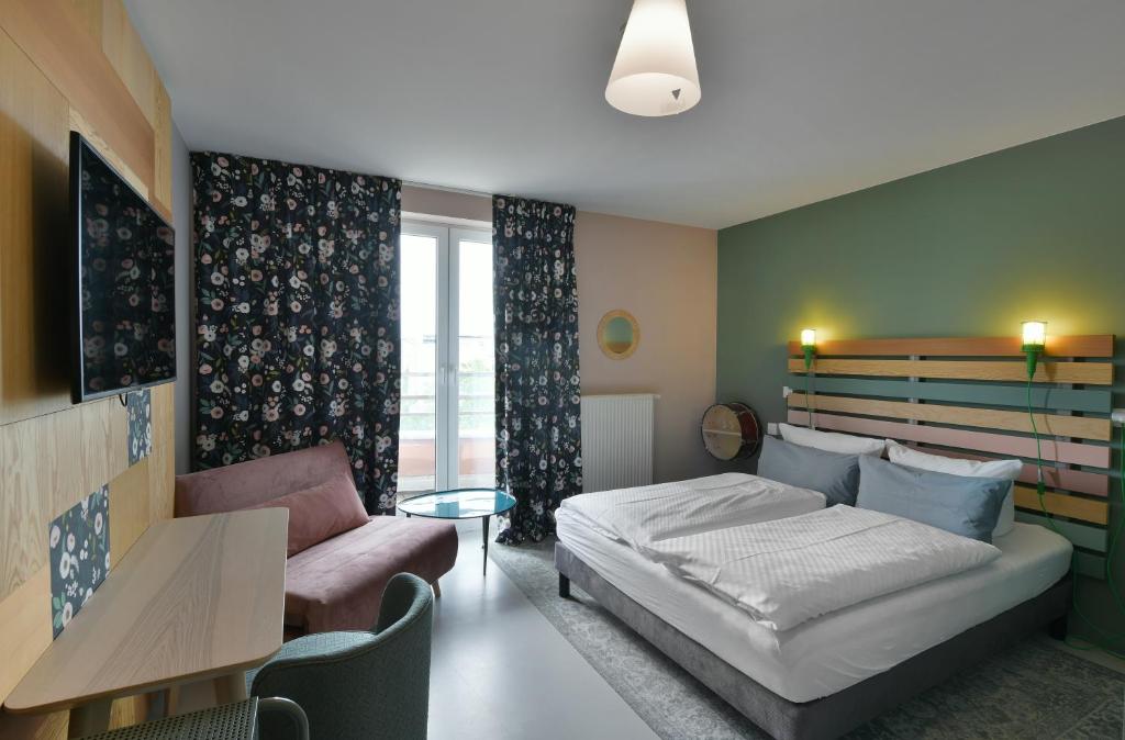 Postel nebo postele na pokoji v ubytování Hotel BIRGIT Berlin Mitte