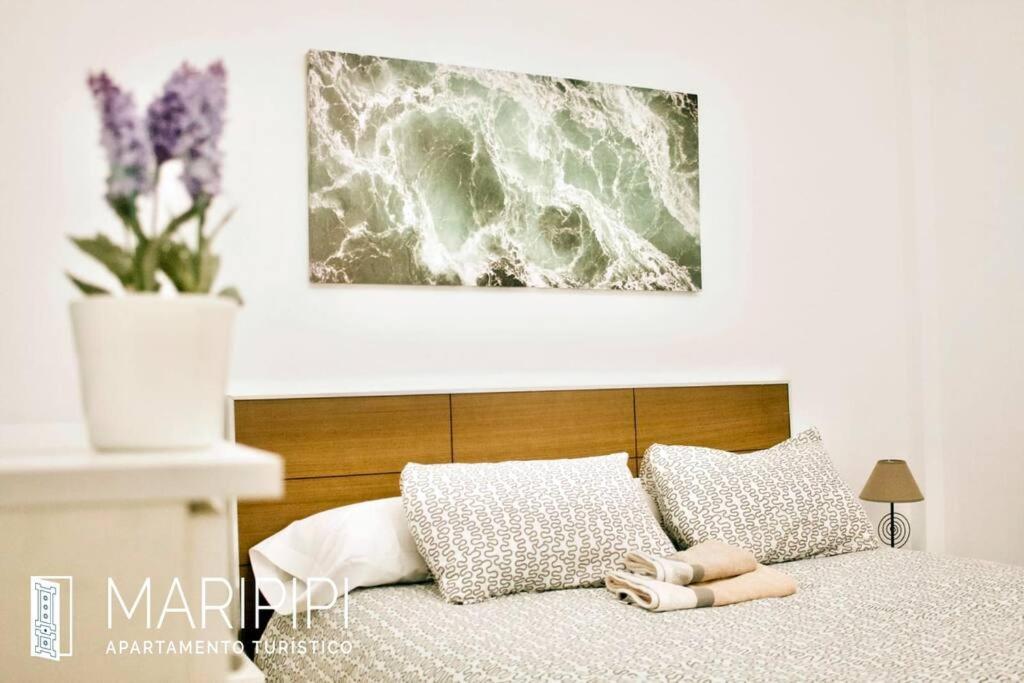 Postel nebo postele na pokoji v ubytování Apartamento maripipi