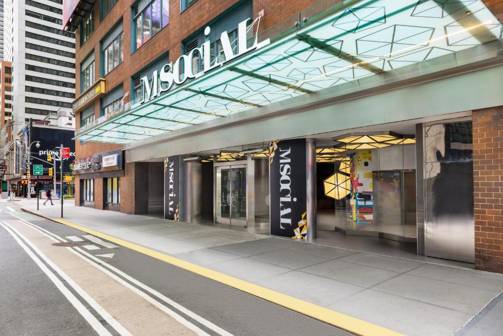 a building with a sign on the side of it at M Social Hotel Times Square New York in New York