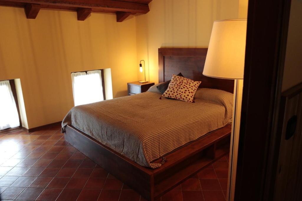 Postel nebo postele na pokoji v ubytování Albergo Rurale Parco di San Floriano