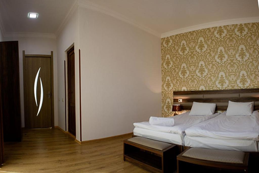 Postel nebo postele na pokoji v ubytování Mestia Residence
