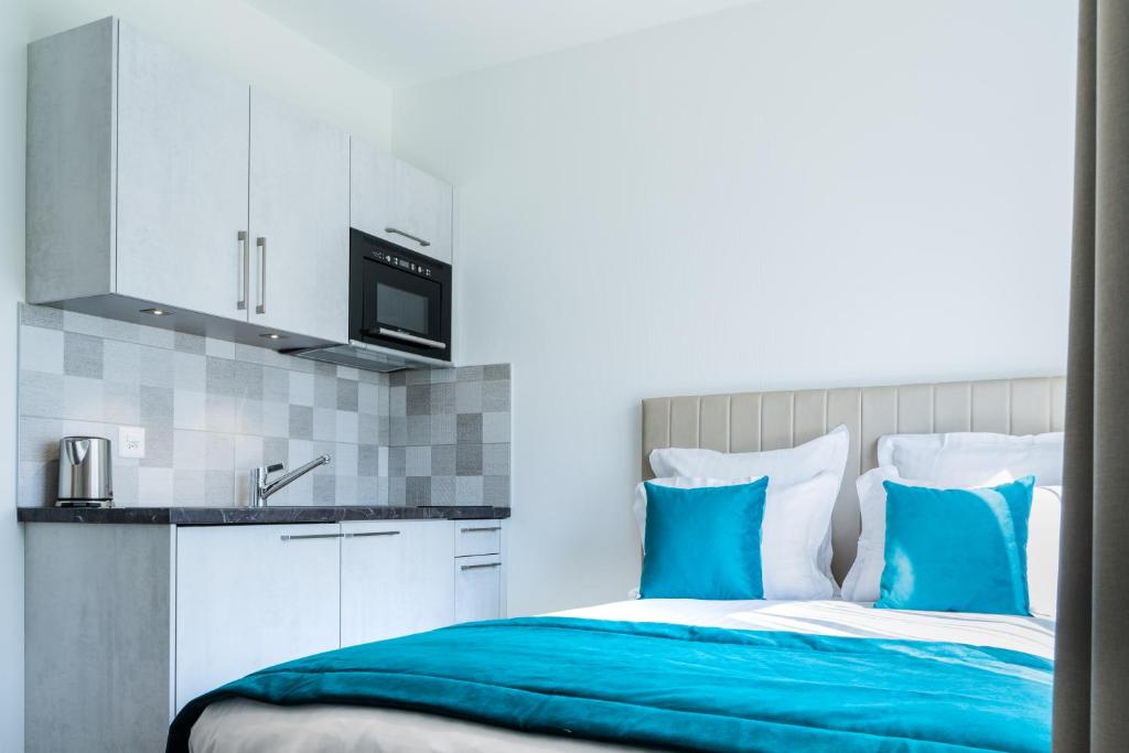 Kuchyň nebo kuchyňský kout v ubytování Motel-Résidence Ô Pied à Terre