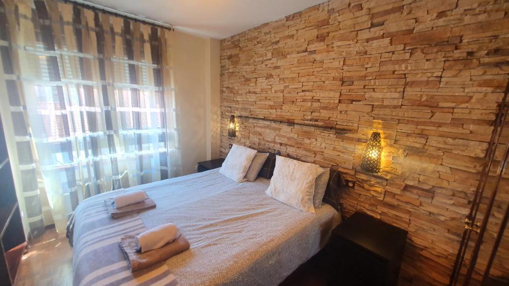 Postel nebo postele na pokoji v ubytování El 5º de Eusebio Miranda - con garaje · Wifi · 3 hab · 2 baños
