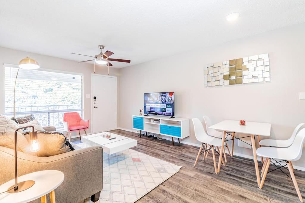 a living room with a couch and a table at SoCo Chic Apartment Suites Close to Downtown in Austin