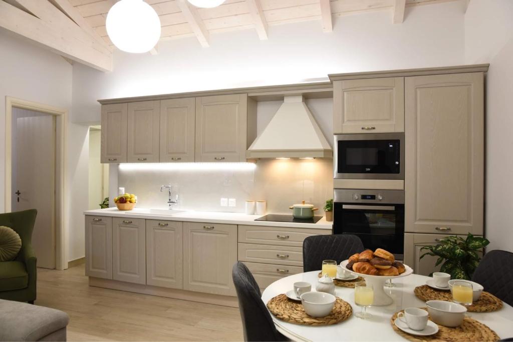 a kitchen with a table with food on it at Mama’s house in Ágios Rókkos