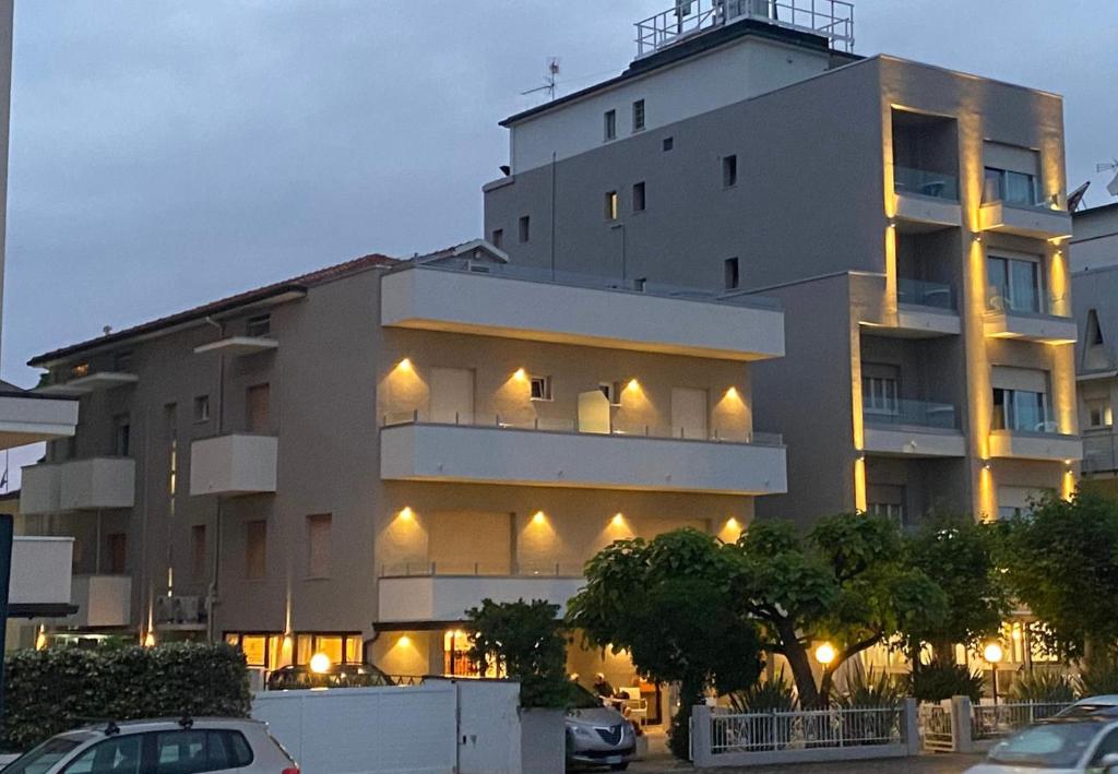 a building with a lot of lights on it at Hotel Sedonia in Cervia