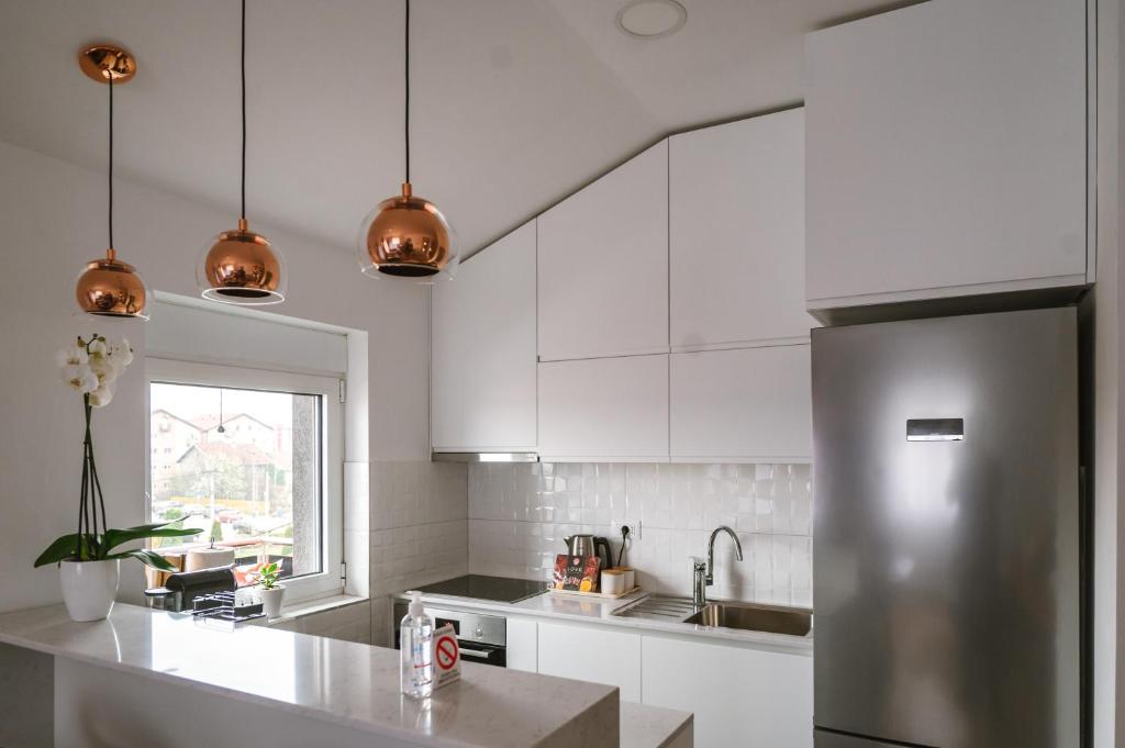 Kuchyň nebo kuchyňský kout v ubytování Mikonos apartman