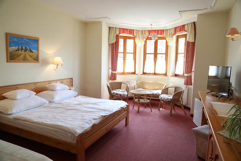 Postel nebo postele na pokoji v ubytování Hajdú Kastély Hotel