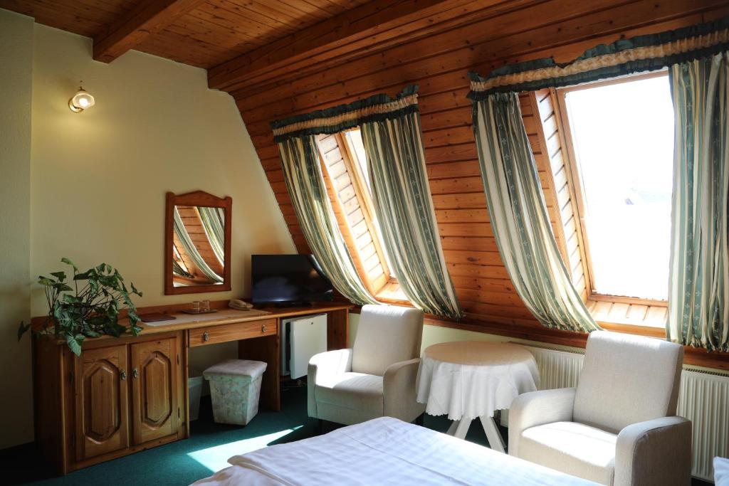 TV a/nebo společenská místnost v ubytování Hajdú Kastély Hotel