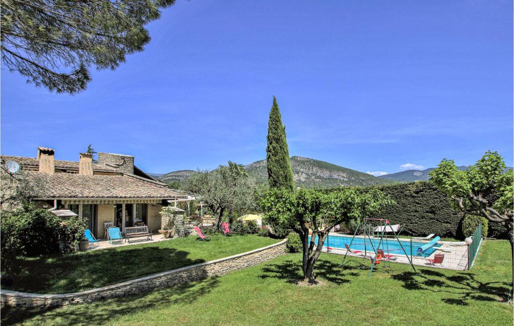 an external view of a house with a swimming pool at Lovely Home In Condorcet With Wifi in Condorcet