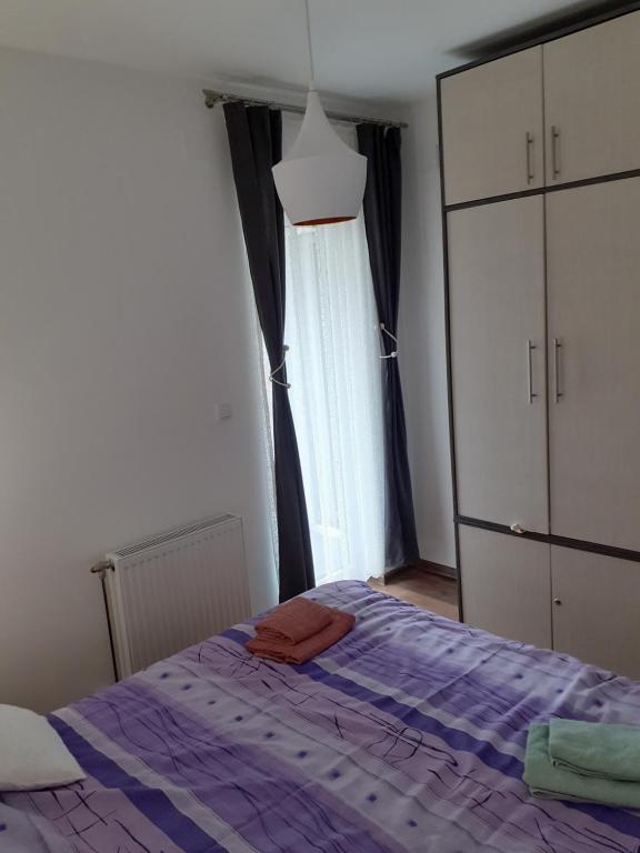 Una cama o camas en una habitación de Apartman Anđela i Aleksa Divčibare