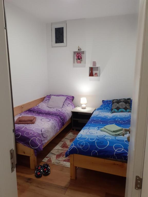 Una cama o camas en una habitación de Apartman Anđela i Aleksa Divčibare