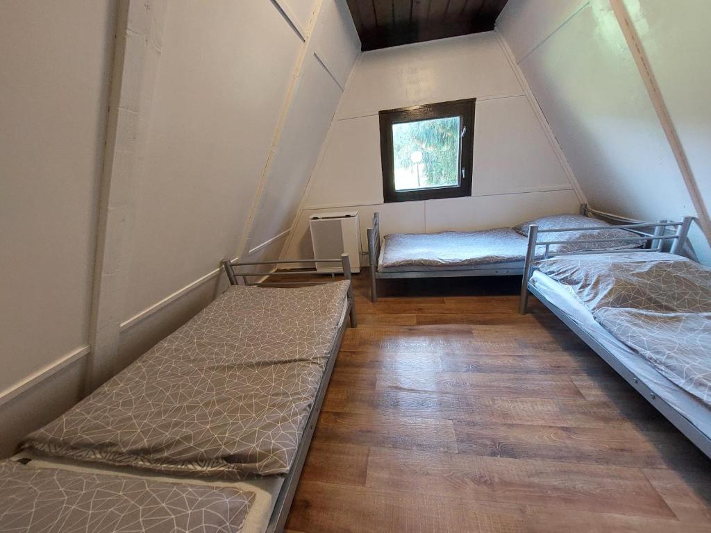 Posteľ alebo postele v izbe v ubytovaní Mátrai Vándor Apartmanok
