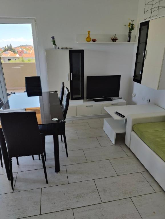 Televízia a/alebo spoločenská miestnosť v ubytovaní Villa Hodl