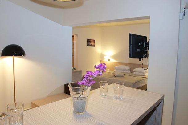 Postel nebo postele na pokoji v ubytování Hotel Sara