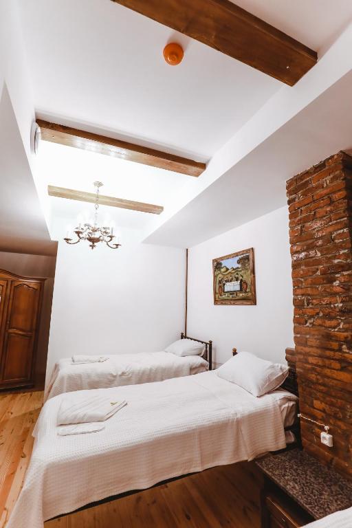 Postel nebo postele na pokoji v ubytování Boutique Hotel Verdzi