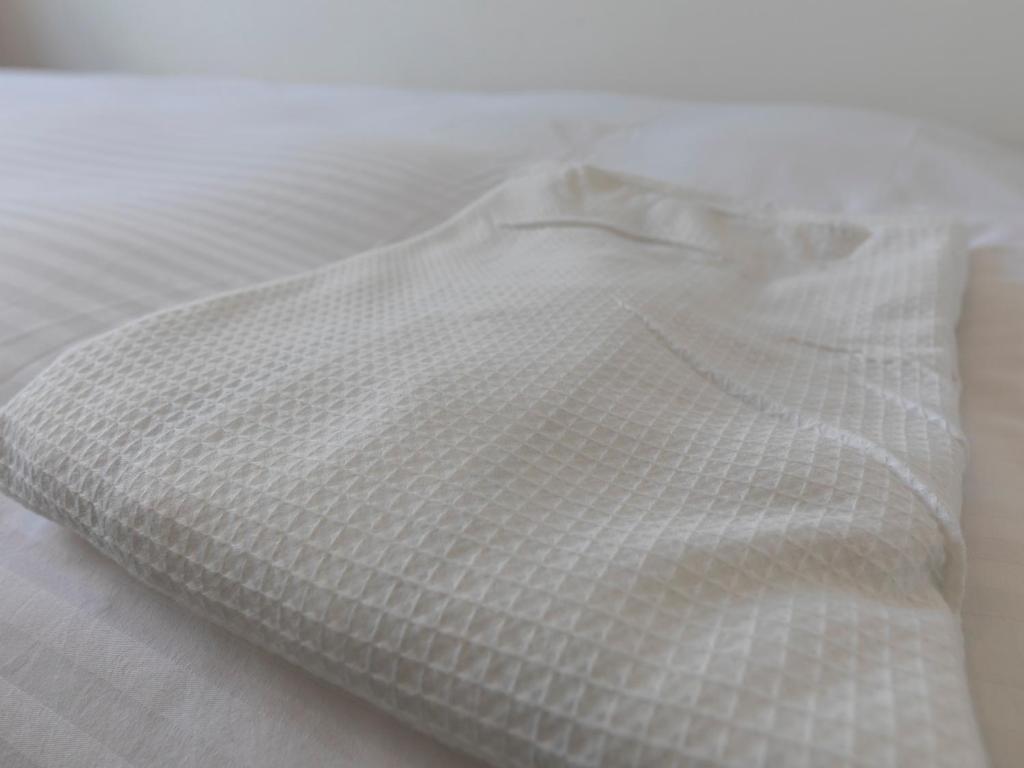 Postel nebo postele na pokoji v ubytování Tabist Hotel Yuan Akashi