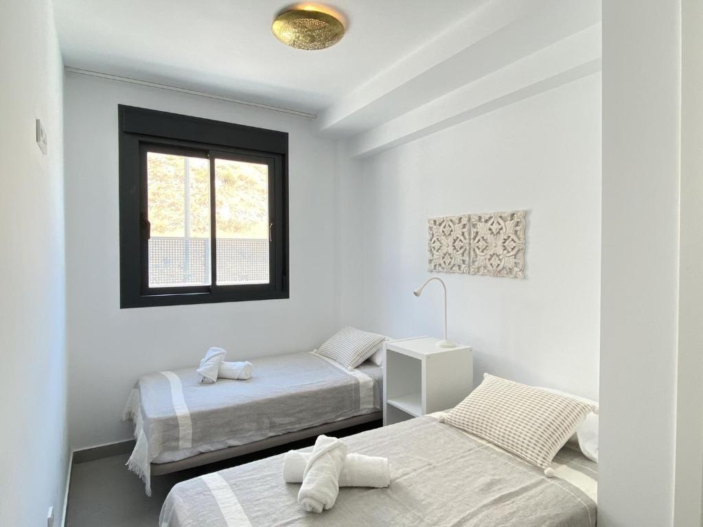 Posteľ alebo postele v izbe v ubytovaní Terrazas de Ladera Duplex 5 Casasol