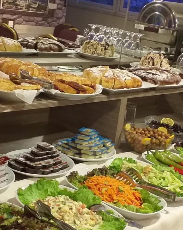 a buffet with many different plates of food at Nagehan Hotel Old City in Istanbul