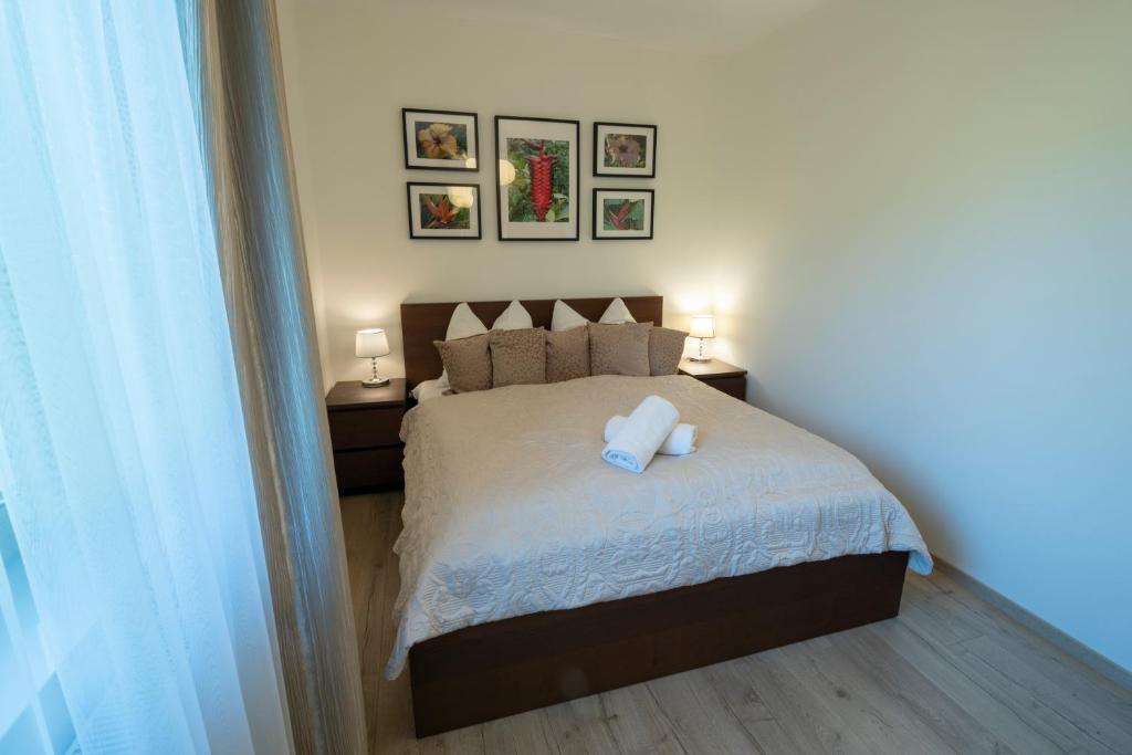 Posteľ alebo postele v izbe v ubytovaní Holiday Family - W Dolinie Szczęścia apartamentowiec Bawaria