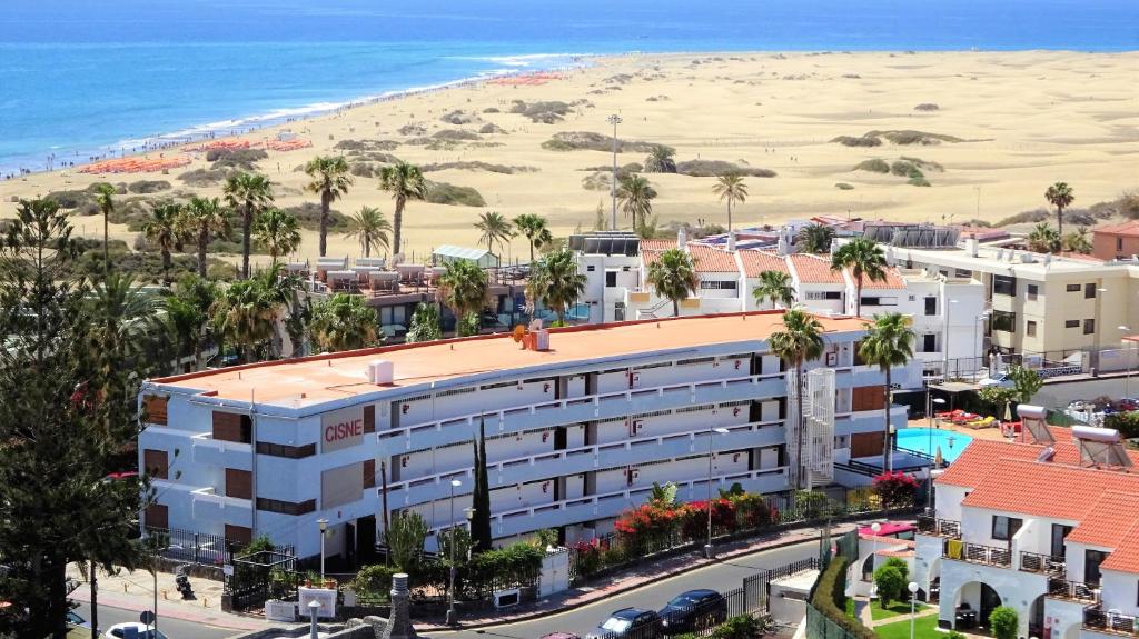 an aerial view of a hotel and the beach at OHMYHOST360 - Paradise Home Holidays in Playa del Ingles