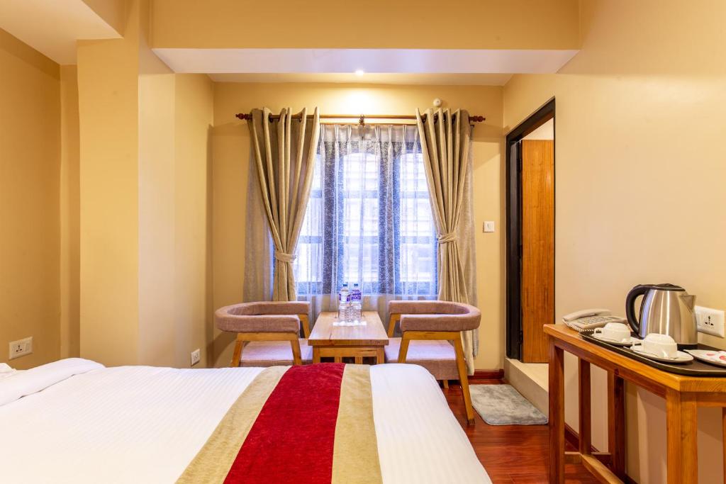 Postel nebo postele na pokoji v ubytování vajra house