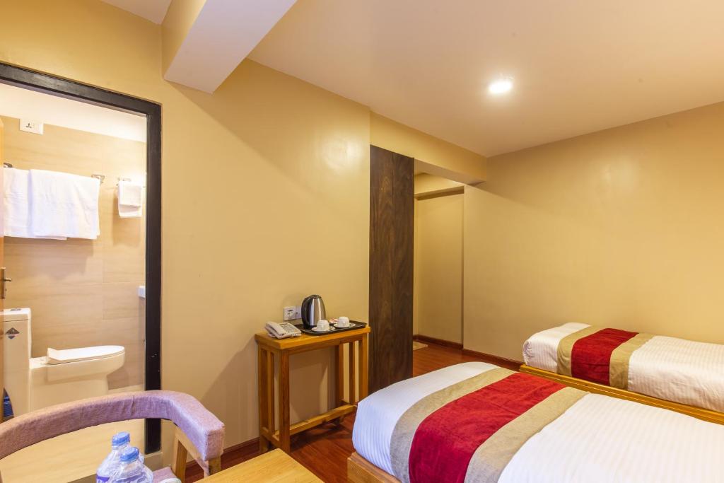 Postel nebo postele na pokoji v ubytování vajra house