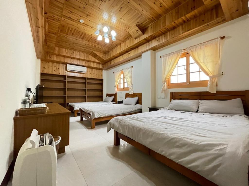 Postel nebo postele na pokoji v ubytování 芹壁山城民宿 Chinbe Hill Village House B&B