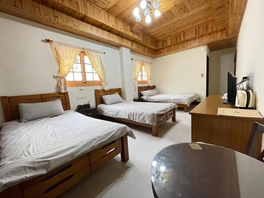 Postel nebo postele na pokoji v ubytování 芹壁山城民宿 Chinbe Hill Village House B&B