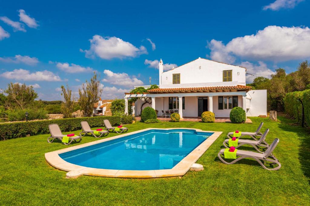a house with a swimming pool in the yard at Villa Son Esbert by Villa Plus in Alaior