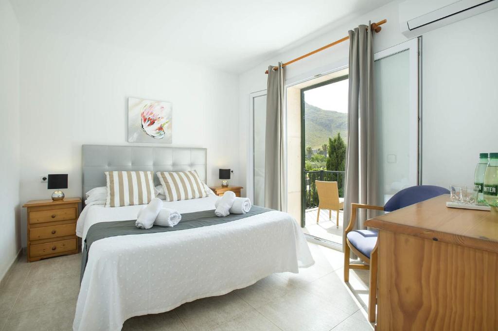 Postel nebo postele na pokoji v ubytování Villa Illa Petita by Villa Plus