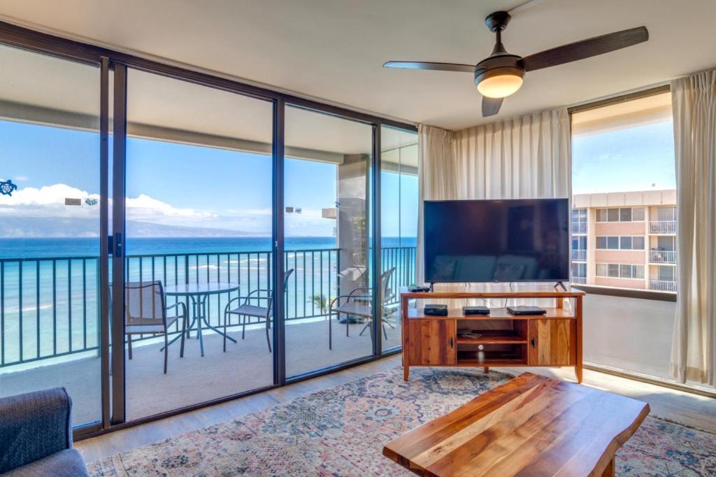 a living room with a view of the ocean at K B M Resorts- VIR-1204 Penthouse Ocean Views! in Kahana