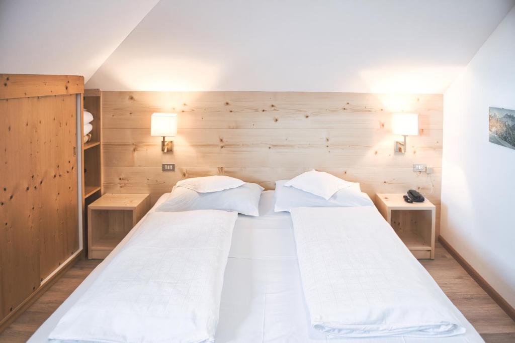 Postel nebo postele na pokoji v ubytování Hotel Gasthof Stern