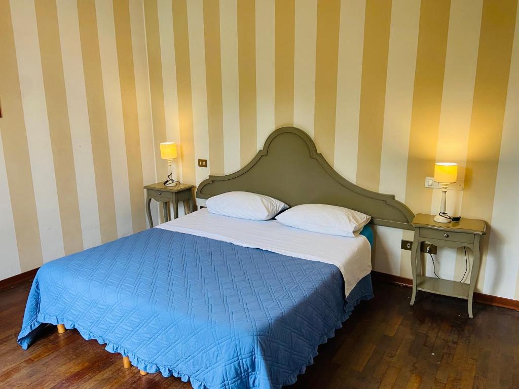 Letto o letti in una camera di B&B Al Ponte