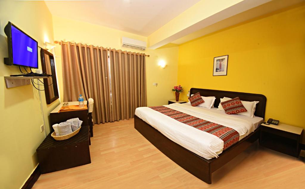 TV a/nebo společenská místnost v ubytování Sacred Boutique Hotel
