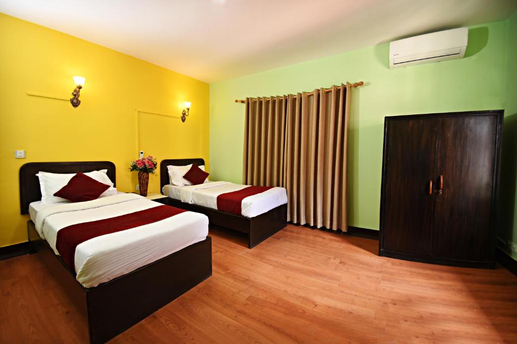 Postel nebo postele na pokoji v ubytování Sacred Boutique Hotel