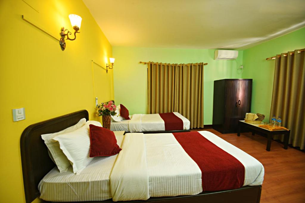 Postel nebo postele na pokoji v ubytování Sacred Boutique Hotel